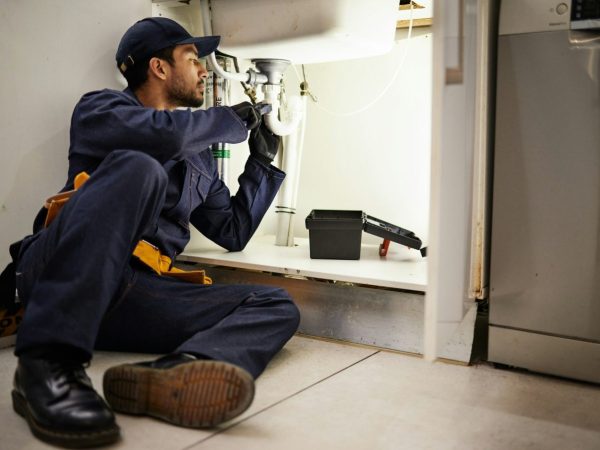 plumbing-handyman-and-maintenance-with-man-in-kitchen-for-repair-industrial-and-inspection-pipes.jpg